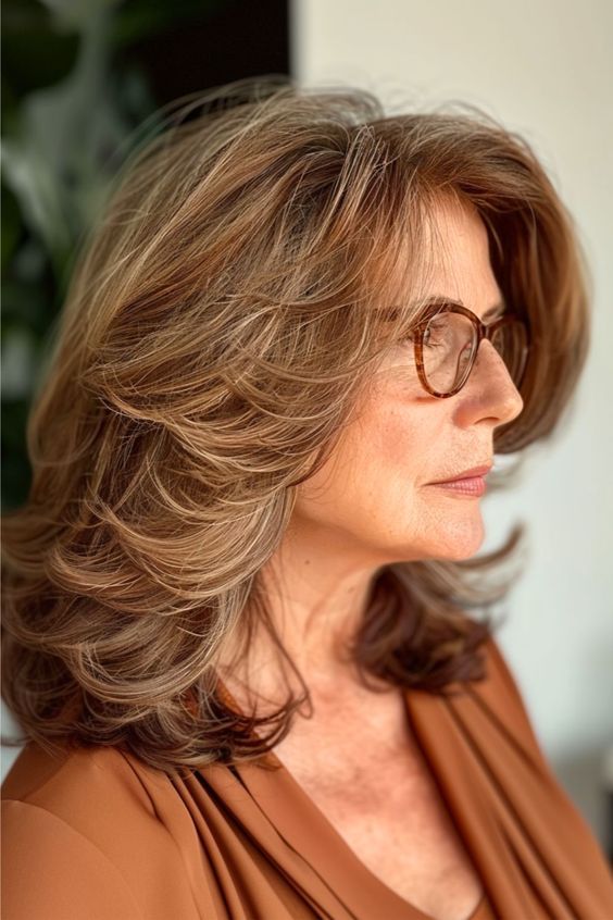 Best hairstyle for women over 60 with glasses - Feathered Midi Cut
