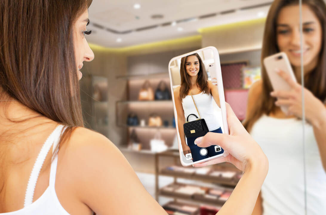 User trying bags online on a smartphone using AR Bags Technology.
