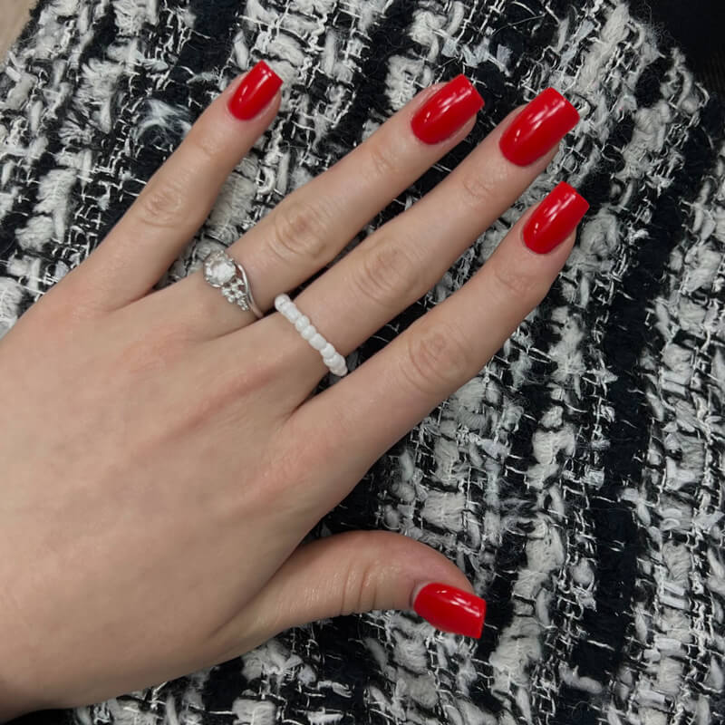 Classic candy cane red nails are a great choice for winter. Try on classic red nails in real time with Beauty Agent in YouCam Makeup app.