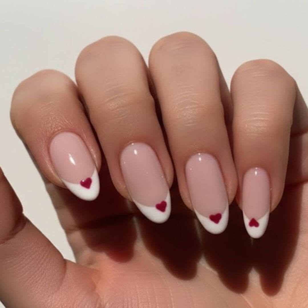 White Nails with Red Heart Tips