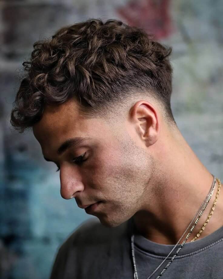 Try this hairstyle if you're a man with curly hair. Experiment with different curly hairstyles in real time using AI.