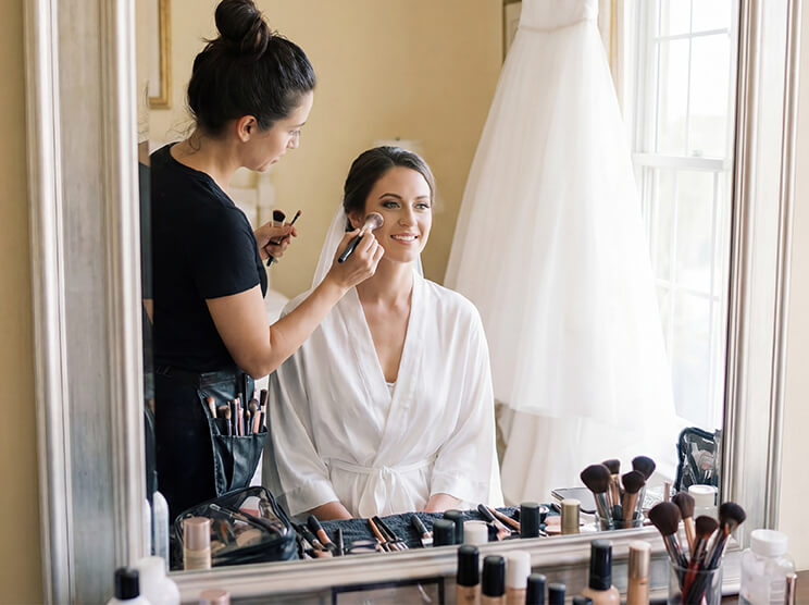 Record hair and makeup, outfit details, and candid laughter with your bridal party. Use this idea for your wedding video.