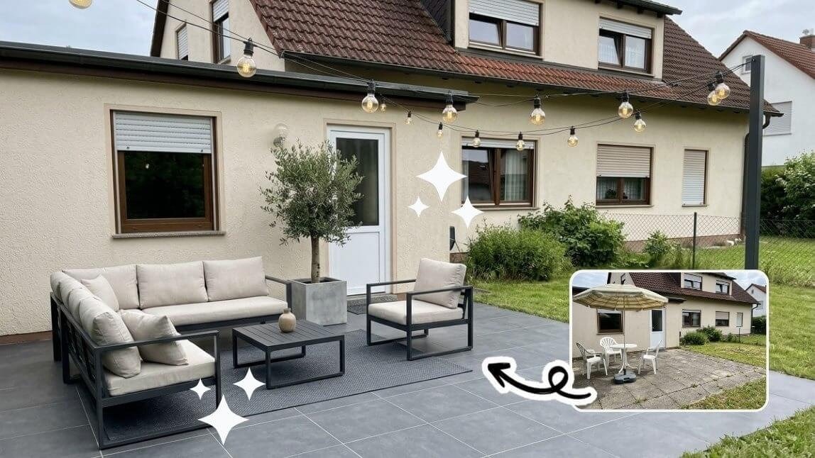Moderne Terrasse mit anthrazitfarbenen Feinsteinzeugfliesen, grauer Lounge-Möblierung, Olivenbaum im Betonkübel und Lichterketten