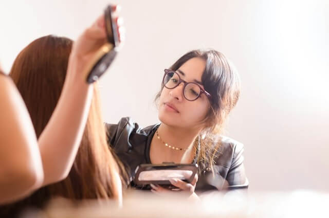 Beauty and Makeup Consultation Makeup artist applying makeup on to a customer