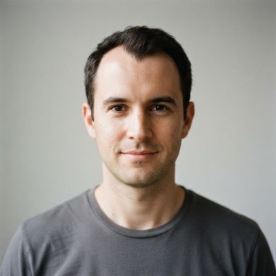 Man with a receding M-shaped hairline at the temples