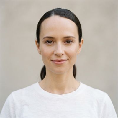 Woman with hair pulled back showing a high, uneven hairline