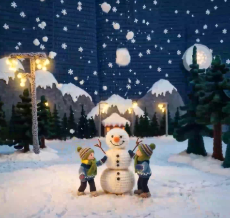 “Create a video about two adorable knitted children playing in a snowy crochet landscape, building a yarn snowman, soft wool snowflakes falling, colorful knitted winter outfits with visible stitching, warm and playful handmade atmosphere, ultra-detailed wool and crochet textures.”