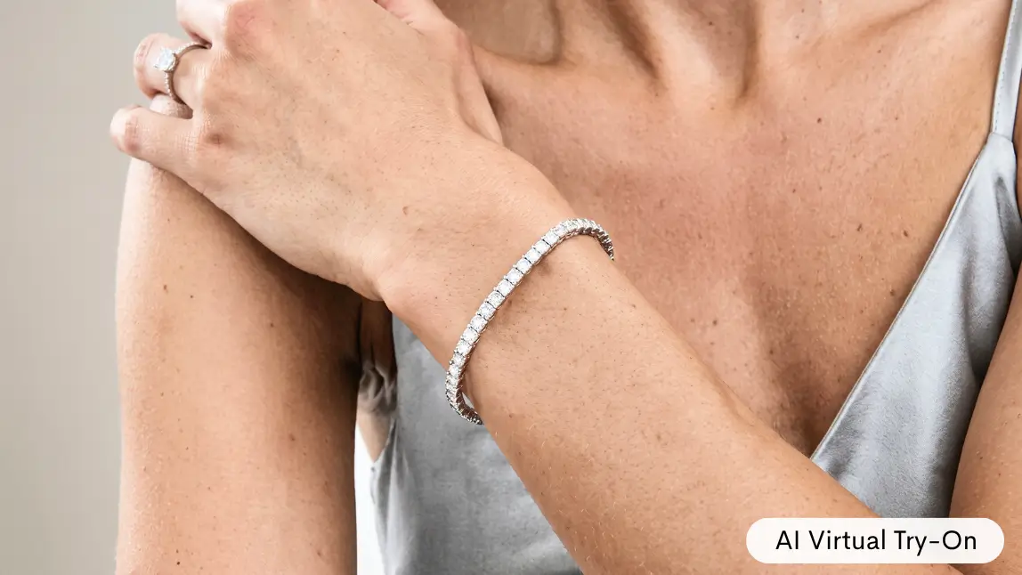 Close up of a wrist wearing a diamond tennis bracelet